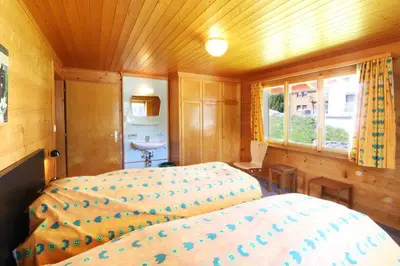 Ein Bett oder Betten in einem Zimmer der Unterkunft Chalet les Mayens