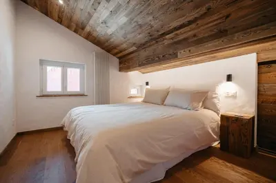 Ein Bett oder Betten in einem Zimmer der Unterkunft Mountain Bliss Duplex - Saas Fee