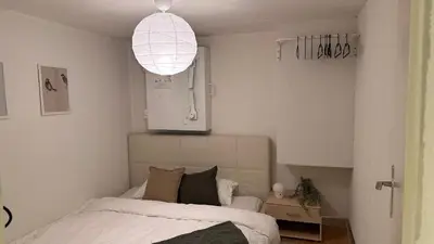Ein Bett oder Betten in einem Zimmer der Unterkunft Meiringen Retreat - Sauna, Terrace & Pinball