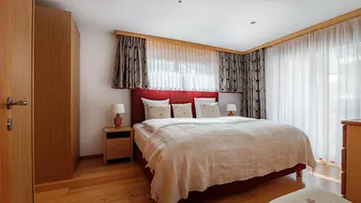 Ein Bett oder Betten in einem Zimmer der Unterkunft Haus Malva by Zermatt Premium Apartments