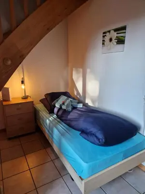 Ein Bett oder Betten in einem Zimmer der Unterkunft Swiss Chalet direkt am Thunersee