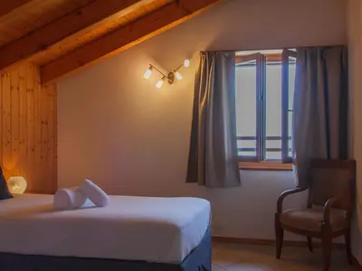 Ein Bett oder Betten in einem Zimmer der Unterkunft Holiday Home Chalet Mirabelle by Interhome
