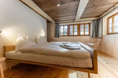 Ein Bett oder Betten in einem Zimmer der Unterkunft POORT A POORT Dorfhotel