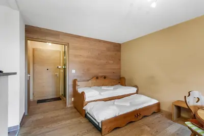 Ein Bett oder Betten in einem Zimmer der Unterkunft Chaleureux studio avec vue sur les montagnes