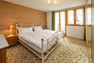 Ein Bett oder Betten in einem Zimmer der Unterkunft Ferienapartments Chalet Solvay