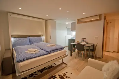 Ein Bett oder Betten in einem Zimmer der Unterkunft Studio Aosta