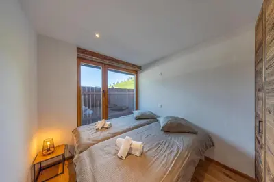 Ein Bett oder Betten in einem Zimmer der Unterkunft Le Chamois l Ski-out l Standing