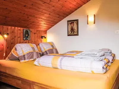 Ein Bett oder Betten in einem Zimmer der Unterkunft Chalet Dominic by Interhome