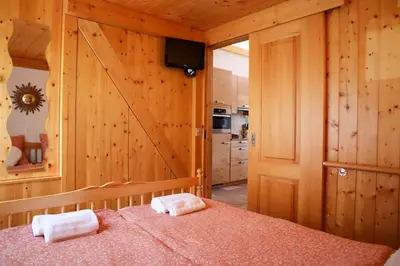 Ein Bett oder Betten in einem Zimmer der Unterkunft Charmante maisonnette avec vue sur les montagnes