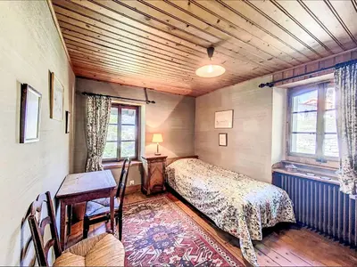 Ein Bett oder Betten in einem Zimmer der Unterkunft Chalet Sergnoud by Interhome
