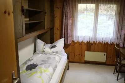 Ein Bett oder Betten in einem Zimmer der Unterkunft Saastal Apartments Haus Antrona