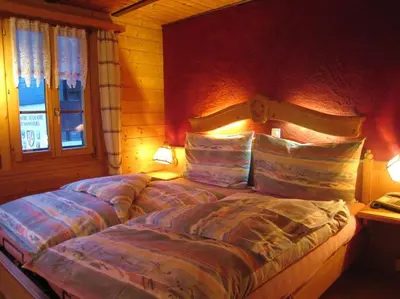 Ein Bett oder Betten in einem Zimmer der Unterkunft Le Manoir d'Anniviers