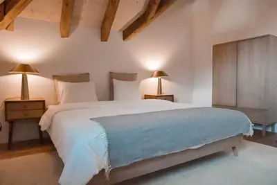 Ein Bett oder Betten in einem Zimmer der Unterkunft Hidden Retreats The GlacierDoor