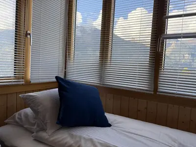 Ein Bett oder Betten in einem Zimmer der Unterkunft Chalet Schweizerhof 4
