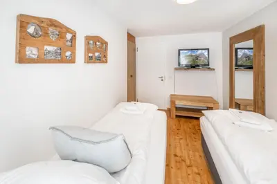 Ein Bett oder Betten in einem Zimmer der Unterkunft Sofi - charming mountain bijou by Inspiring Places Zermatt