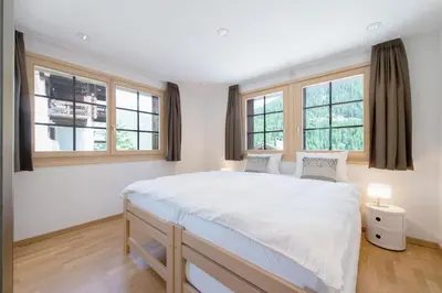Ein Bett oder Betten in einem Zimmer der Unterkunft ESCAPE Chalets
