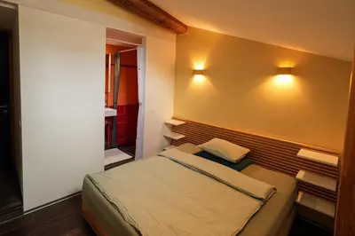 Ein Bett oder Betten in einem Zimmer der Unterkunft Dans ma bulle