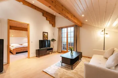 Ein Bett oder Betten in einem Zimmer der Unterkunft Alphorn Chalet by Carista Homes