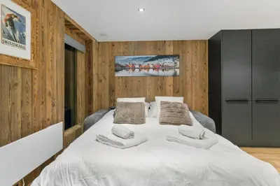 Ein Bett oder Betten in einem Zimmer der Unterkunft Studio élégant au cœur des Alpes