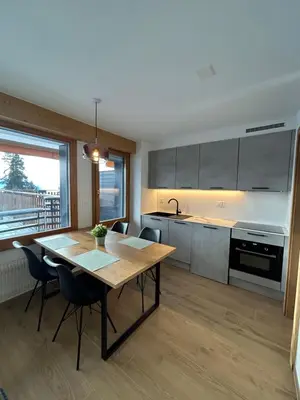 Küche/Küchenzeile in der Unterkunft Studio moderne et cosy avec piscine et sauna