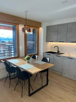 Küche/Küchenzeile in der Unterkunft Studio moderne et cosy avec piscine et sauna
