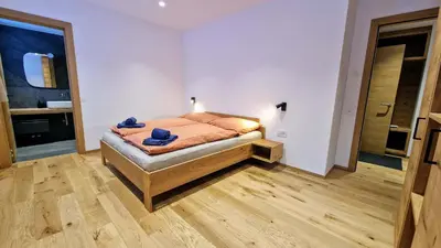 Ein Bett oder Betten in einem Zimmer der Unterkunft Silberdistel Brand-new luxury apartment with private terrace