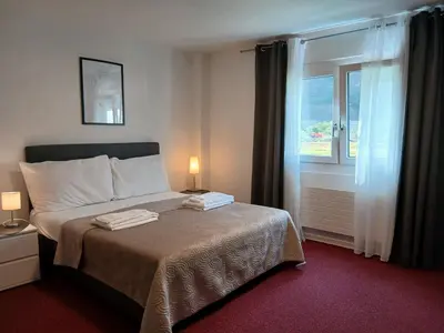 Ein Bett oder Betten in einem Zimmer der Unterkunft Hotel Garni