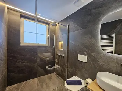 Ein Badezimmer in der Unterkunft Silberdistel EG