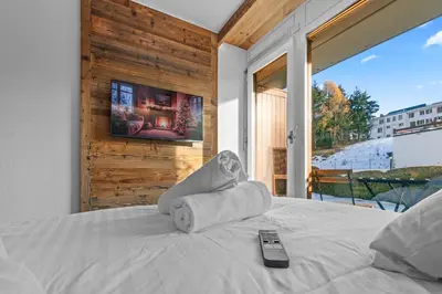 Ein Bett oder Betten in einem Zimmer der Unterkunft Studio chalet rénové au centre de la ville