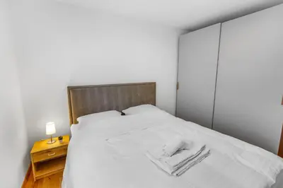 Ein Bett oder Betten in einem Zimmer der Unterkunft Appartement ski aux pieds - domaine des 4 Vallées