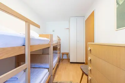Ein Bett oder Betten in einem Zimmer der Unterkunft Schürli Apartment - Aare Jungfrau AG