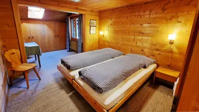 Ein Bett oder Betten in einem Zimmer der Unterkunft Chalet La Sapinière