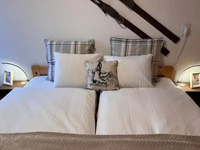 Ein Bett oder Betten in einem Zimmer der Unterkunft Appartement Wengen - Charme Alpin