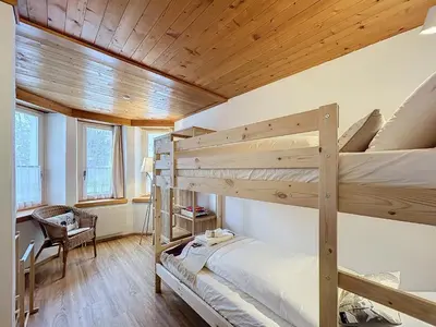 Ein Bett oder Betten in einem Zimmer der Unterkunft Appartement Wengen - Charme Alpin