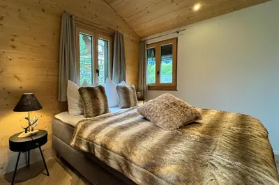 Ein Bett oder Betten in einem Zimmer der Unterkunft Chalet Gletscherliechtli