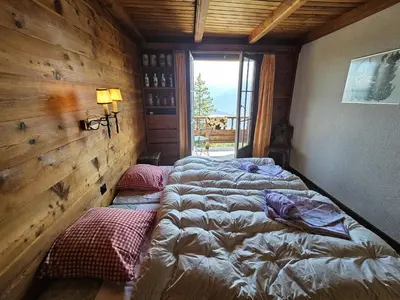 Ein Bett oder Betten in einem Zimmer der Unterkunft Vue 180 - Au pied des pistes - Typique et alpin