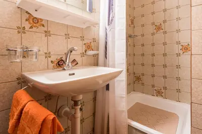 Ein Badezimmer in der Unterkunft Haus Alpenblick