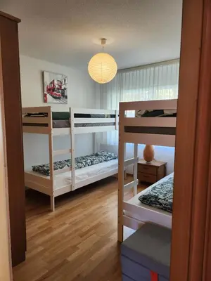Ein Bett oder Betten in einem Zimmer der Unterkunft Résidence au cœur du village