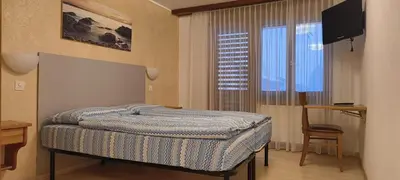 Ein Bett oder Betten in einem Zimmer der Unterkunft B&B Restaurant Pizzeria Mamma Mia