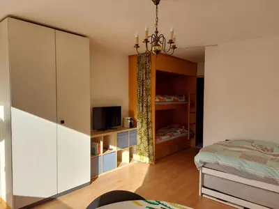 Ein Bett oder Betten in einem Zimmer der Unterkunft Belair 20 - Ski Pisten Erli, super Aussicht!