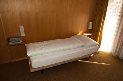 Ein Bett oder Betten in einem Zimmer der Unterkunft Hotel Garni Simplon