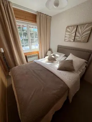 Ein Bett oder Betten in einem Zimmer der Unterkunft Chalet cosy avec vue sublime
