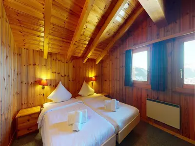 Ein Bett oder Betten in einem Zimmer der Unterkunft Chalet in Veysonnaz with swimming pool