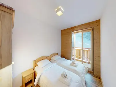 Ein Bett oder Betten in einem Zimmer der Unterkunft Pleasant apartment in Versonnaz
