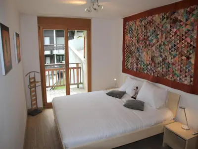 Ein Bett oder Betten in einem Zimmer der Unterkunft Modern apartment with sauna