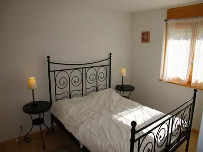 Ein Bett oder Betten in einem Zimmer der Unterkunft Charming Apartment With Balcony