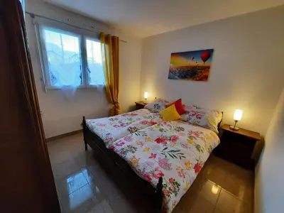 Ein Bett oder Betten in einem Zimmer der Unterkunft Au pied du Coteau ensoleillé