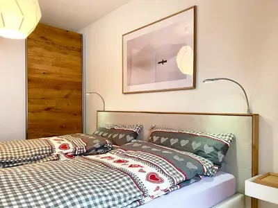Ein Bett oder Betten in einem Zimmer der Unterkunft Adler Residenz 14