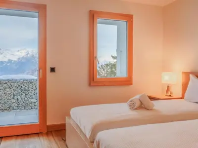 Ein Bett oder Betten in einem Zimmer der Unterkunft Chalet Nous Deux by Interhome
