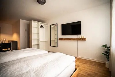 Ein Bett oder Betten in einem Zimmer der Unterkunft MALU appartment Zermatt